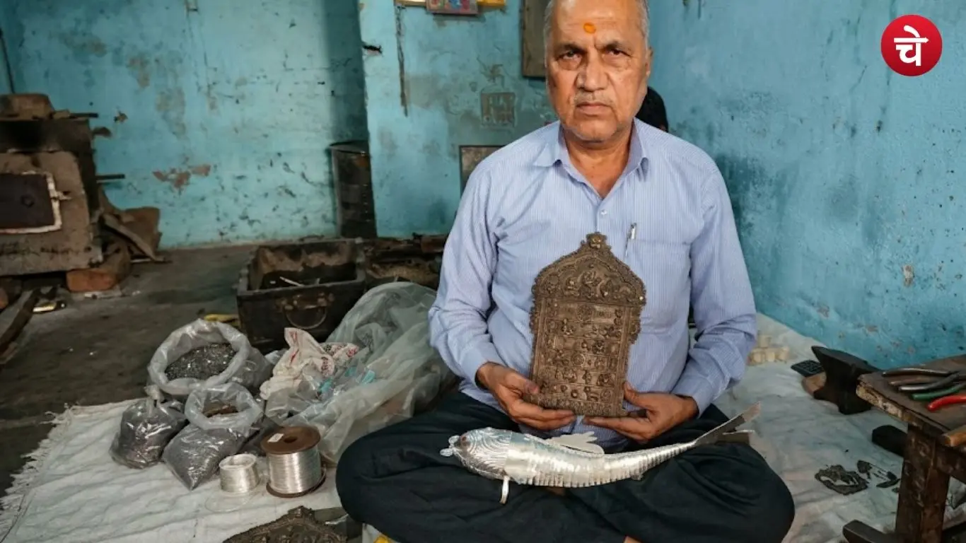 A picture of an artisan in Maudaha, Hamirpur, who crafts silver fish